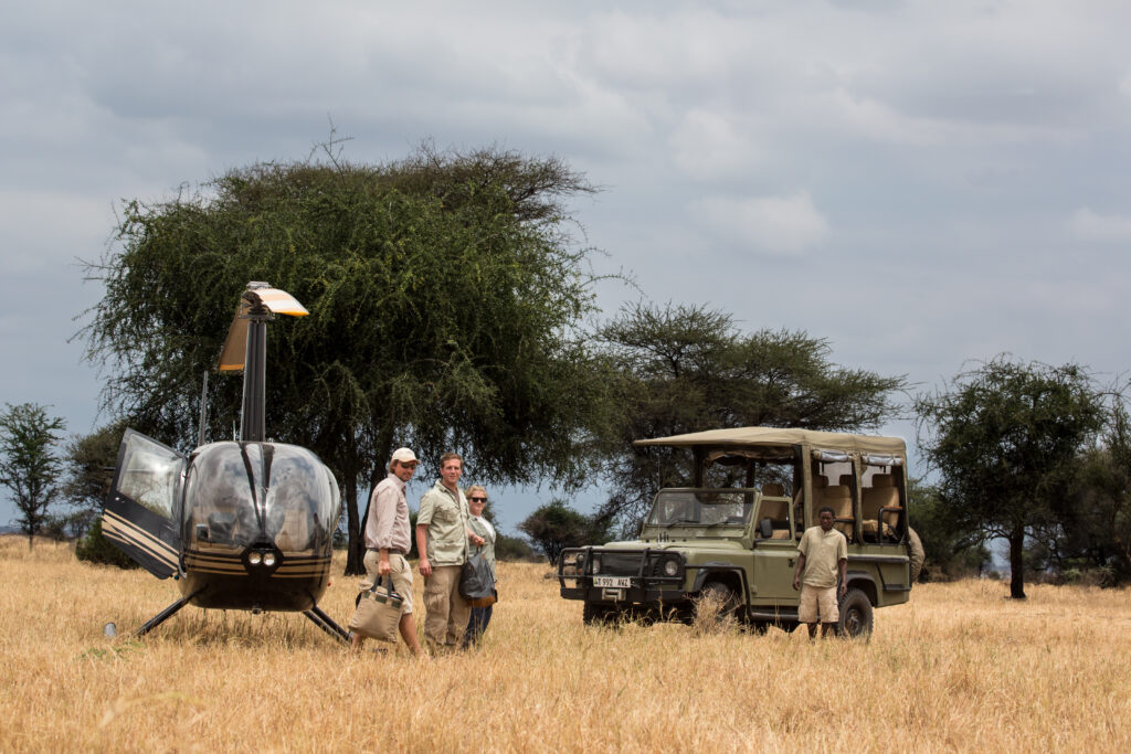 Helicopter and safari car in Africa